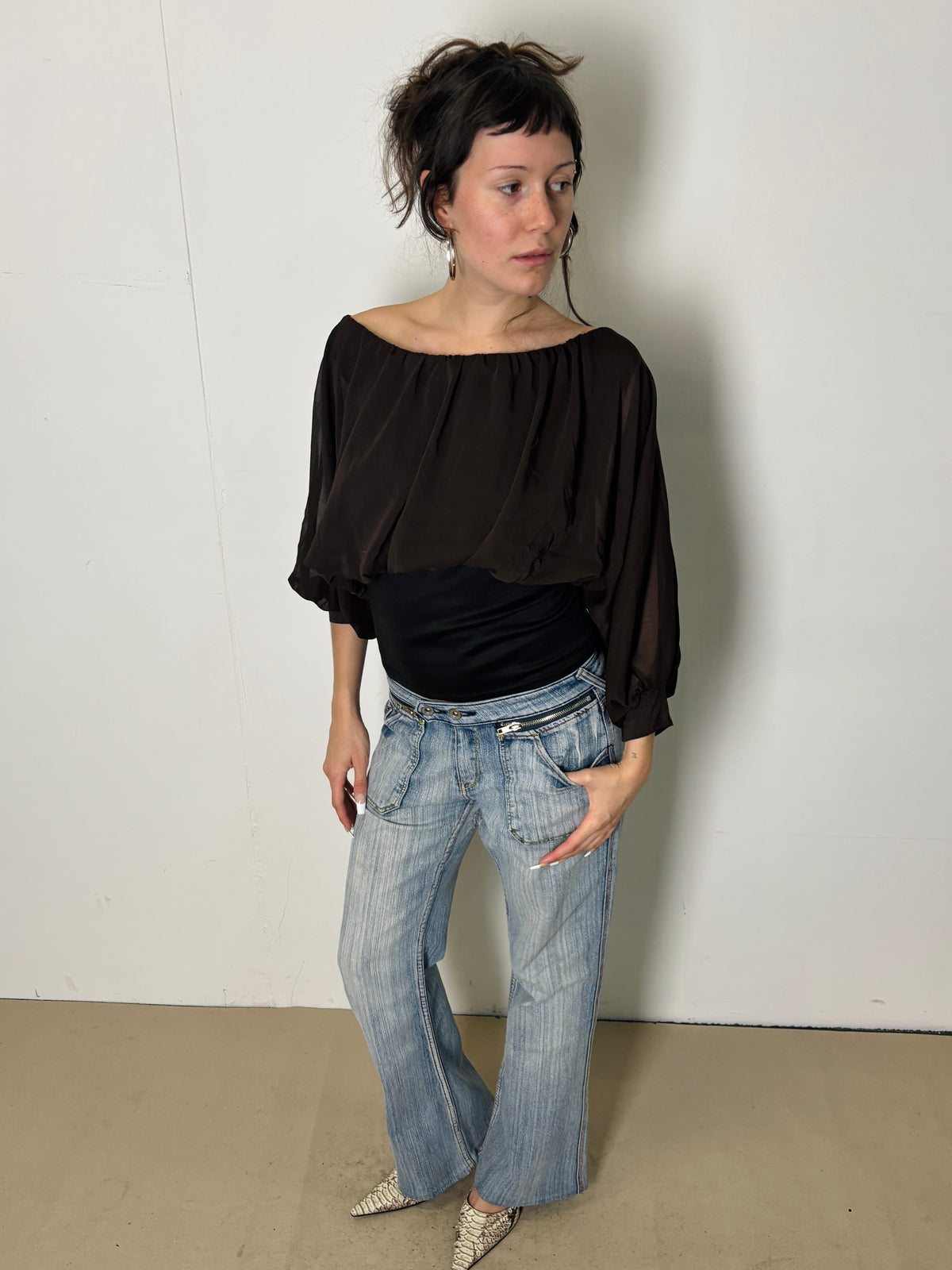 brown and black flowy blouse